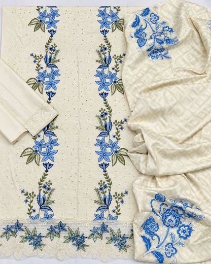 Cream Dhanak 3-piece embroidered women's suit with blue floral Chikankari-style embroidery, embroidered daman border, plain sleeves and trouser, and printed matching shawl, design K-711.