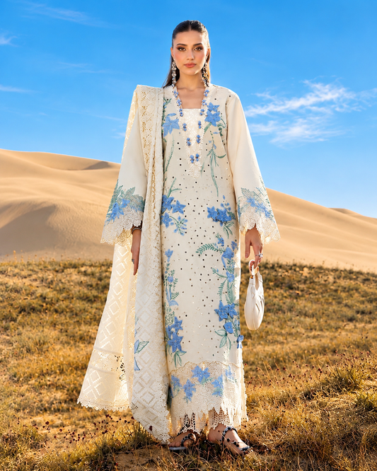 Cream Dhanak 3-piece embroidered women's suit with blue floral Chikankari-style embroidery, embroidered daman border, plain sleeves and trouser, and printed matching shawl, design K-711.